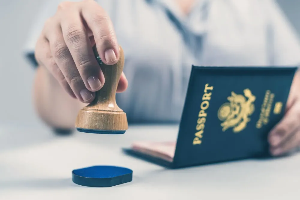 Close up of border security stamping a United States passport